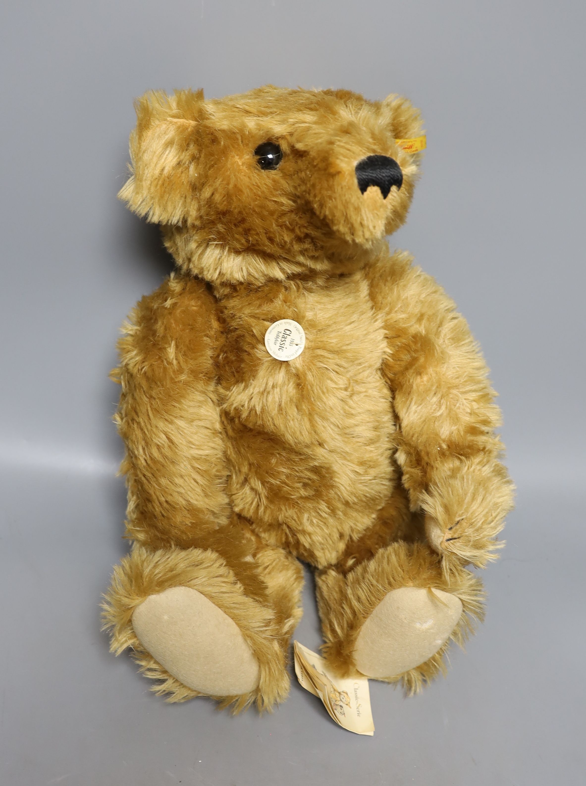 Steiff Classic 1903 bear with Steiff Limited Edition 'Algy' Pug from Rupert Series with Steiff Limited Edition 'Bill the Badger', Rupert Series both with box and certificate, bear 47 cms high.